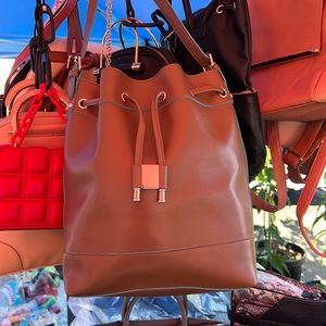 Brown tan bucket bag with blue trimmings